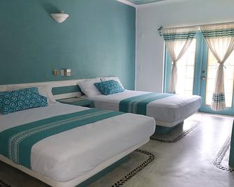 Hotel Plaza Delphinus - La Crucecita - Bedroom