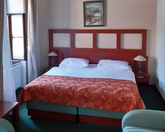 Vivaldi Apartments - Mikulov - Camera da letto