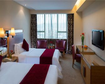 Vienna Hotel Shenzhen Pinghu Center Metro Station - شينزهين - غرفة نوم