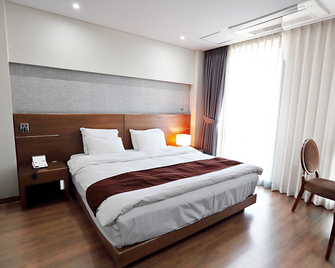 Andong Grand Hotel - Andong - Ložnice
