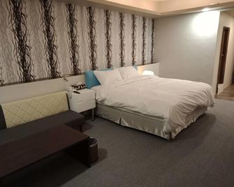 Aiyue Hotel - Huwei Township - Habitación