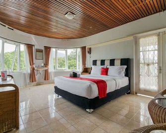 RedDoorz near Ngarai Sianok Bukittinggi - Bukittinggi - Schlafzimmer
