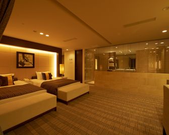 Kokusai 21 International Hotel - נגאנו - חדר שינה