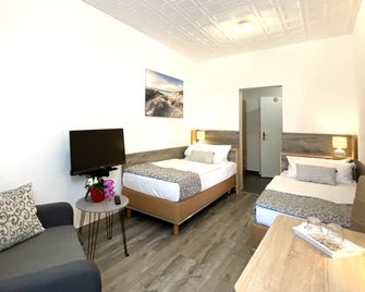 Hotel am Gutspark Prager GbR - Lipsia - Camera da letto
