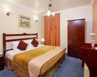 Al Bustan Tower Hotel Suites - Sharjah - Bedroom