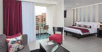 The Morgana Poblado Suites Hotel - เมเดยิน - ห้องนอน