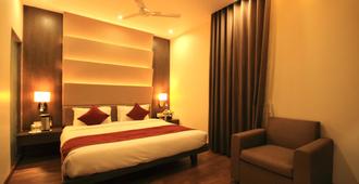 Hotel Naeeka - Ahmedabad - Slaapkamer