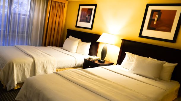 Garden Inn & Suites - קווינס - חדר שינה