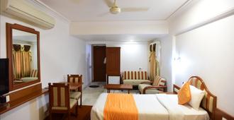 Hotel Aditi - ואדודרה - חדר שינה