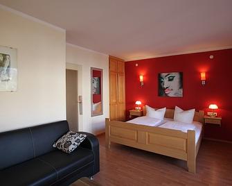 Hotel Atlas Sport - גרמיש-פרטנקירכן - חדר שינה