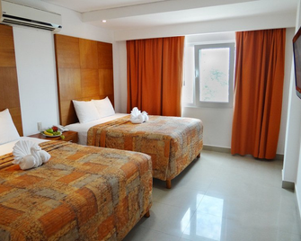 سويتس جابي كانكون - كانكون - غرفة نوم