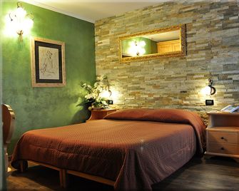 Hotel La Montanara - סן מרטינו די קאסטרוצה - חדר שינה