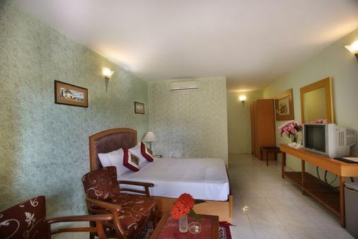 Jayamahal Palace Hotel - Bengaluru - Bedroom