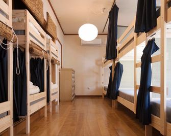 Tsuruya Guesthouse - Hostel - הירושימה - חדר שינה