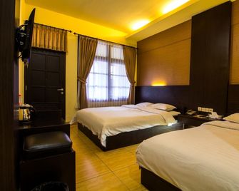 Hotel Setia Budi Syariah Redpartner - Madiun - Slaapkamer