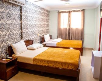 Yegoala Hotel Kumasi - 쿠마시 - 침실