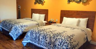 FairBridge Inn & Suites Merced/Gateway to Yosemite - Merced - Bedroom