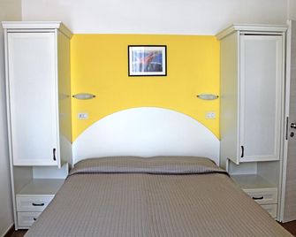 Hotel Philadelphia - קתוליקה - חדר שינה