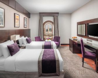 أجنحة المجيدي أراك - المدينة المنورة - غرفة نوم