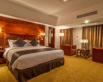 Long Beach Suites Dhaka - Dhaka - Quarto, Hotéis em Dhaka