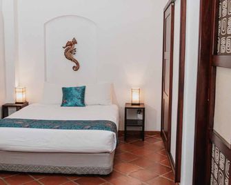 Hotel Galapagos Suites B&B - Puerto Ayora - Yatak Odası