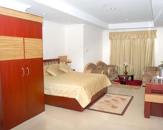 Hotel Kpm Tripenta - Palakkad - Camera da letto