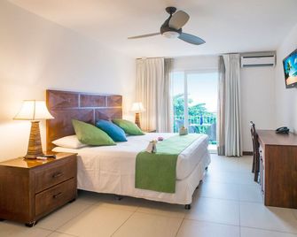 بارادايس بيتش ريزورت آند دايف سنتر - Coxen Hole - غرفة نوم