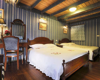 Cingjing Hanging Garden & Resort - רן-איי - חדר שינה