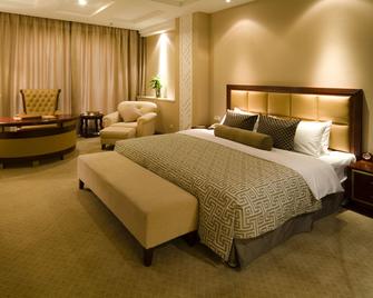 Nanchang Galactic Peace International Hotel - נאנצ'אנג - חדר שינה