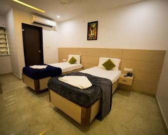 OYO 49222 Sri Aditya Inn Boutique Hotel - Rājahmundry - Спальня
