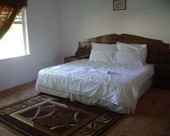 Rainbow Guesthouse - East London - Schlafzimmer