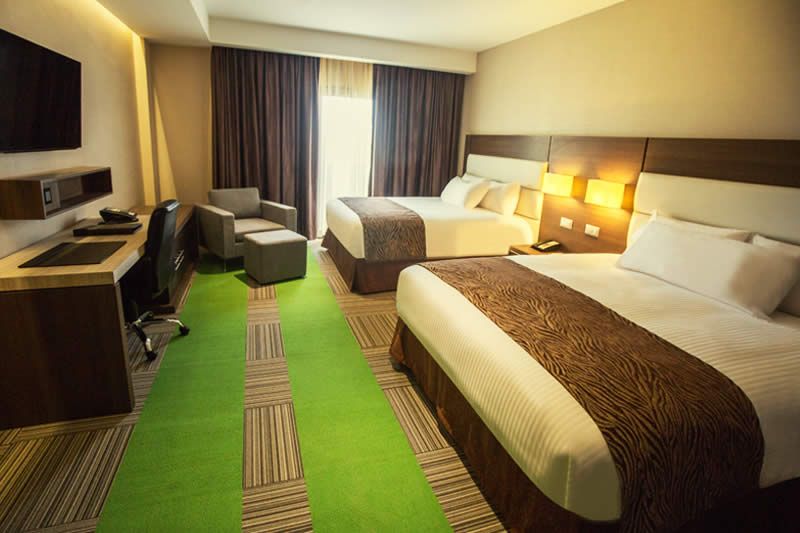 يوروبويلدينج هوتل آند سويتس كورو - كورو - غرفة نوم