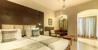 Budget Inn Bellevue - Surat - Camera da letto