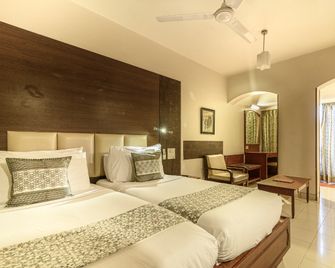 Budget Inn Bellevue - Surat - Schlafzimmer