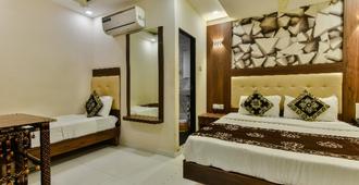 OYO 7046 Hotel Guest Inn - Bombay - Yatak Odası