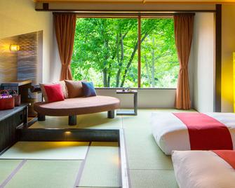 هوشينو ريزورتس أويراسي كيرو هوتل - اوموري - غرفة نوم