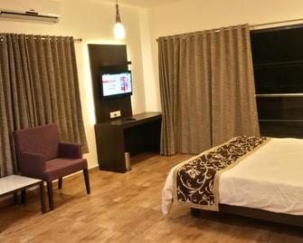 Hotel Aditya - Sasan Gir - Slaapkamer