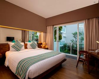 Grand Ixora Kuta Resort - Kuta - Bedroom
