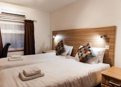 OYO Arinza Hotel - Ilford - Bedroom