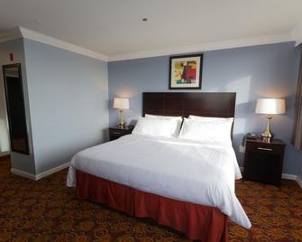 Amco Hotel And Suites Austin - Austin - Schlafzimmer