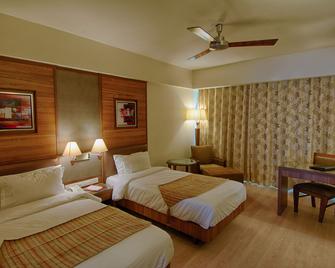 The President-A Boutique Hotel - Ahmedabad - Bedroom
