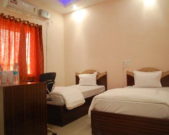 Hotel Om International - Bodhgaya - Slaapkamer